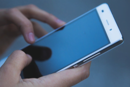 Hands using phone